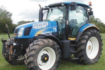 blue tractor on a field