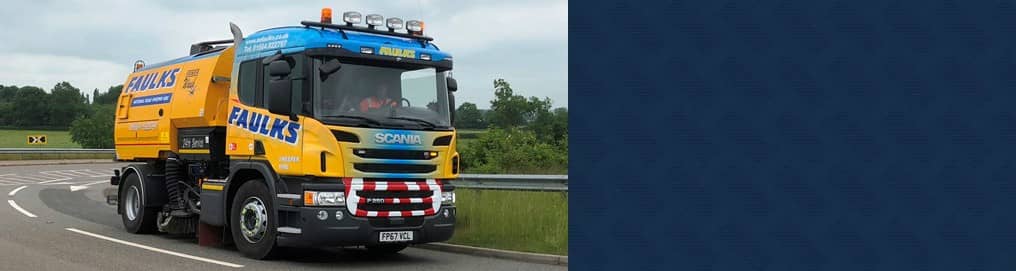 scania sweeper truck on the road