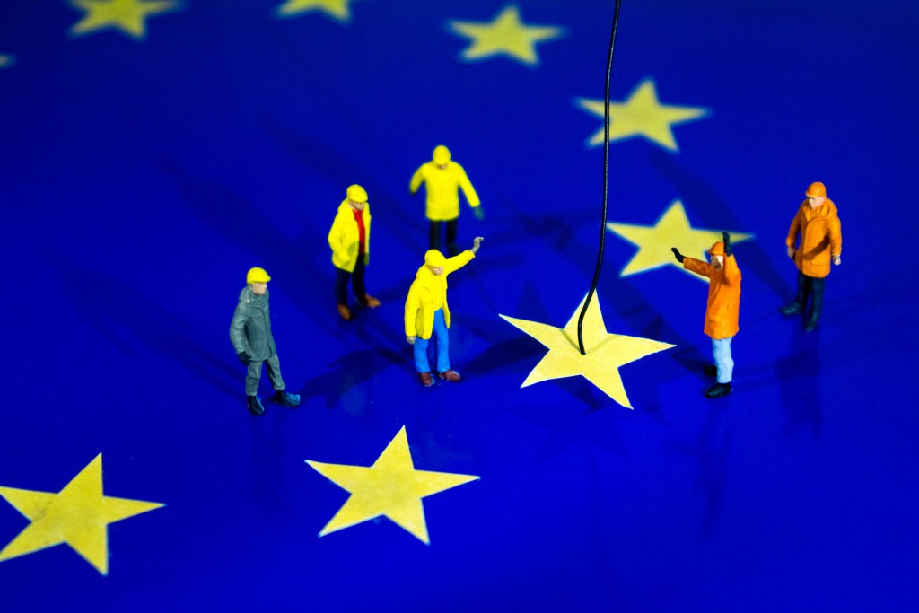 Little Construction Workers Removing a Star from the EU Flag