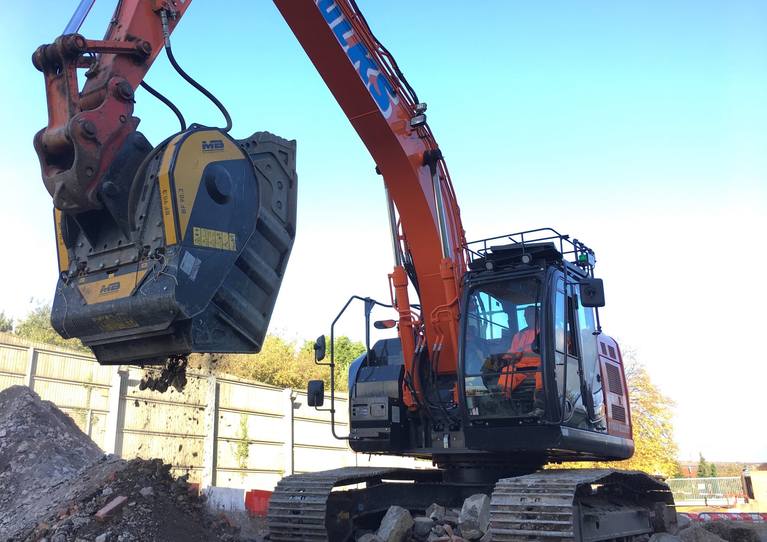 Crusher Bucket working in a building