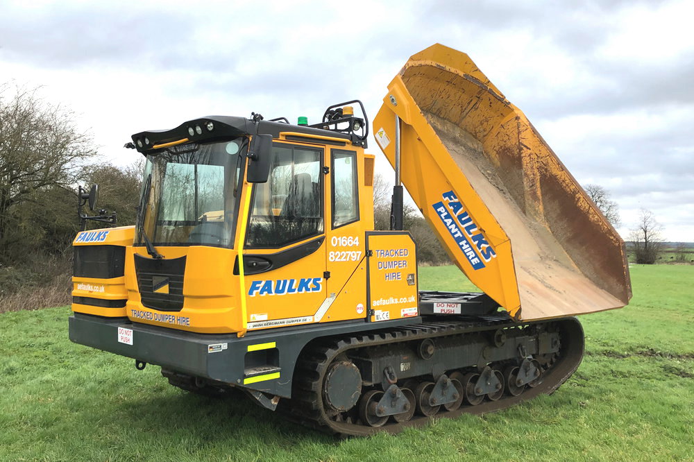 The Bergmann 4010R tracked dumper, available for plant hire, in field with dumper loader tipped