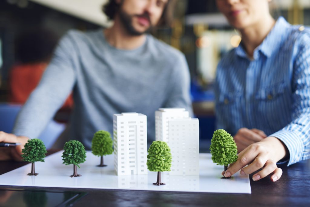 Construction workers planning an eco friendly project